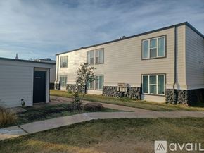 Yukon apartment for rent - A modern two-story house with a garage and a front yard.