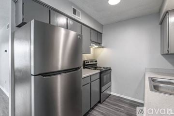 Yukon apartment for rent - A modern kitchen with a stainless steel refrigerator and dishwasher.