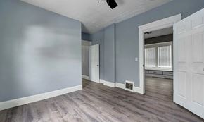 Cleveland apartment for rent - A room with a grey wall and a white door.