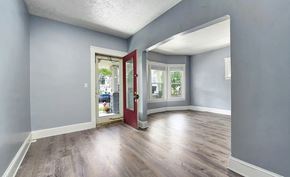 Cleveland apartment for rent - A room with a red door and grey walls.