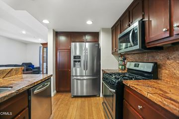 Camarillo apartment for rent - A kitchen with wooden cabinets and stainless steel appliances.