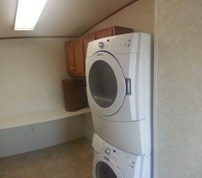 Billings house for rent - A white washing machine in a laundry room.