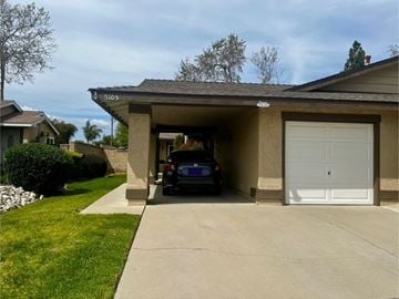 Camarillo house for rent - A car is parked in a garage with the number 5105 on the wall.