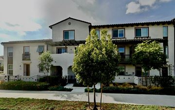 Camarillo apartment for rent - A white two-story house with a balcony on the second floor.