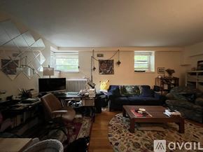 Brookline apartment for rent - A living room with a couch, chair, and coffee table.