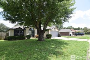 Killeen house for rent - A white bathroom with a tub and a door.