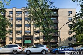 Chicago condo for rent - A building with the sign "BEALL PROPERTIES" on a car in front.