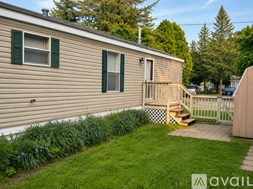 Dollar Bay house for rent - A kitchen with wooden cabinets and a white fridge.