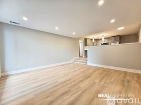 Chicago condo for rent - A modern stainless steel dishwasher is installed in a kitchen.