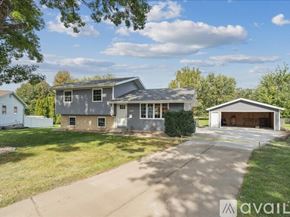 Waterloo house for rent - A two-story house with a garage is situated in a residential area.