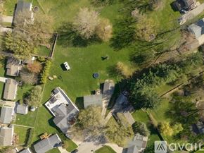Waterloo house for rent - A bird's eye view of a neighborhood with houses and trees.