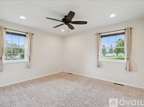 Waterloo house for rent - A kitchen with white cabinets and a marble countertop.