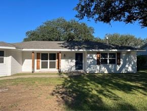 Bay City house for rent - A white house with a black roof and a brown door.