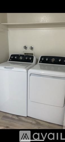 Lake Havasu City apartment for rent - A white toilet sits next to a sink in a small bathroom.