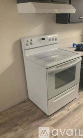Lake Havasu City apartment for rent - A hallway with a wooden floor and white walls.
