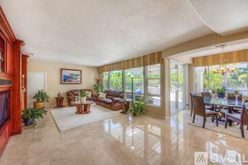Yorba Linda apartment for rent - A living room with a television and a dining table.