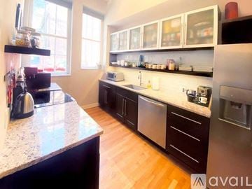 Richmond apartment for rent - A kitchen with a granite counter top and stainless steel appliances.