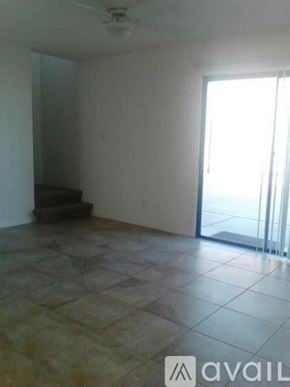Arizona City apartment for rent - A room with tiled flooring and a ceiling fan.