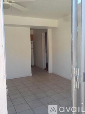 Arizona City apartment for rent - A room with a tiled floor and a ceiling fan.