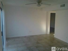 Arizona City apartment for rent - A room with a ceiling fan and tiled floor.