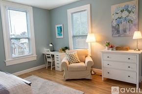 Lafayette apartment for rent - A bedroom with a large bed and a nightstand.