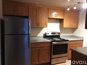Seattle apartment for rent - A bathroom with a toilet, sink, and bathtub.