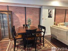 Indianapolis townhouse for rent - A dining room with a wooden table and chairs.