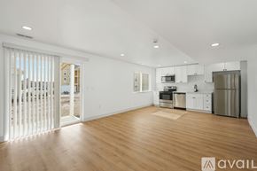 Lehi apartment for rent - A spacious kitchen with wooden floors and stainless steel appliances.