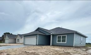 Bay City house for rent - A two-story house with a garage is shown in the image.
