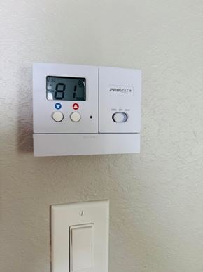 Bay City house for rent - A ProStat+ device is mounted on a wall, displaying a digital reading of 81.