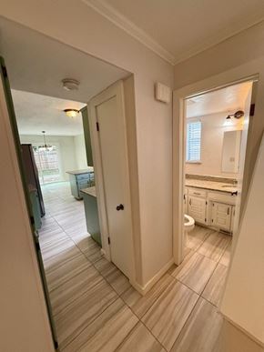 Oklahoma City apartment for rent - A bathroom with a toilet, sink, and mirror.