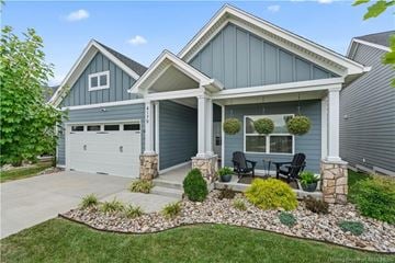 Jeffersonville house for rent - A house with a grey garage door and a white roof.