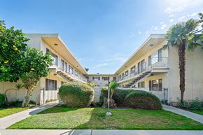 Burbank apartment for rent - A sunny day at a residential complex with a clear blue sky.