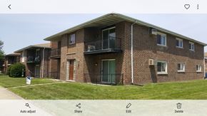 Burnham apartment for rent - A brick building with a balcony on the second floor.