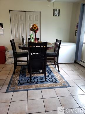 Burnham apartment for rent - A dining room with a table and chairs.