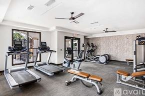 Tampa apartment for rent - A gym with treadmills, elliptical machines, and weights.