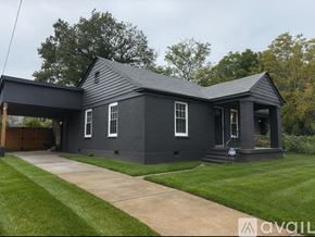 Memphis house for rent - A bathroom with a toilet, sink, and bathtub.