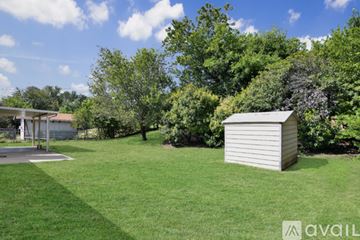Killeen house for rent - A kitchen with a stainless steel refrigerator and a white oven.