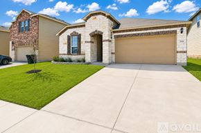 Killeen house for rent - A house with a stone facade and a brown garage door.