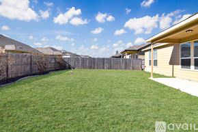 Killeen house for rent - A spacious room with a ceiling fan and tiled flooring.
