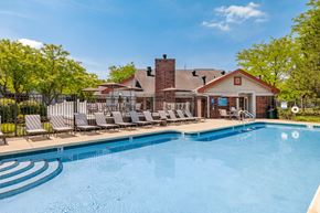 Buffalo Grove apartment for rent - A pool with a building behind it.