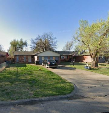 Oklahoma City house for rent - A house with a car parked in front.