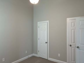 Wilson house for rent - A room with two doors, one of which is open.