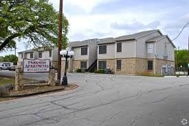 Mansfield apartment for rent - A building with a sign that says "Parkside Apartments" in front of it.
