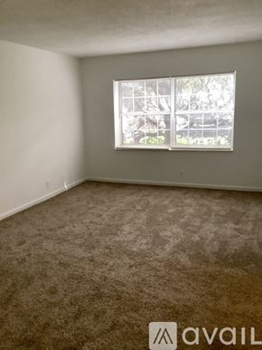 Knoxville apartment for rent - A room with a carpet floor and a wooden counter top.