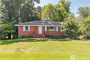 Smyrna house for rent - A room with a ceiling fan and wooden flooring.