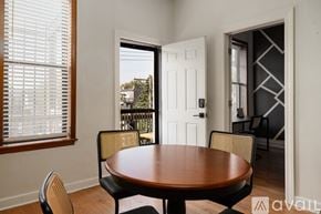 Chicago apartment for rent - A dining room with a wooden table and chairs.