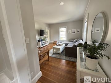 Portland apartment for rent - A living room with a white couch and a coffee table.