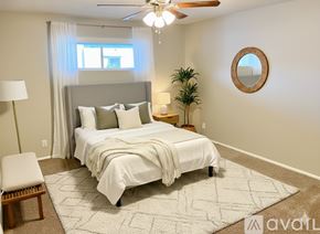Phoenix apartment for rent - A black stove and microwave in a kitchen with wooden cabinets.