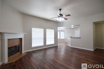 Temple house for rent - A kitchen with wooden cabinets and a black dishwasher.